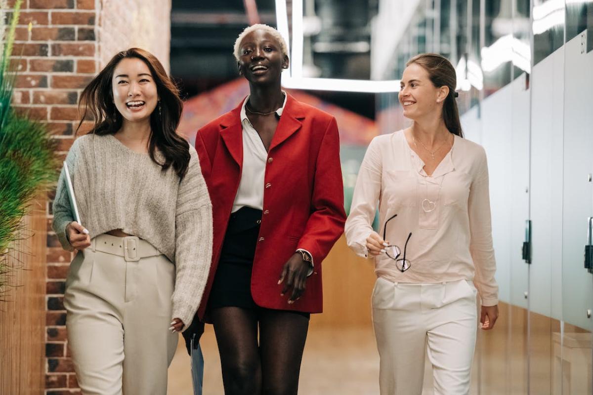 three people walking down a hallway