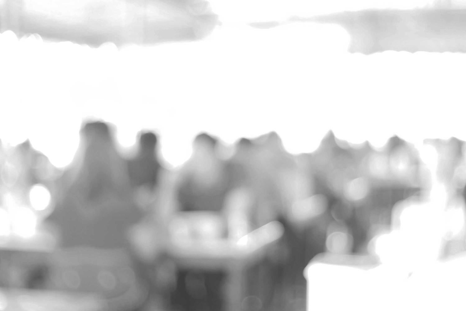 Black and white blurry image of people