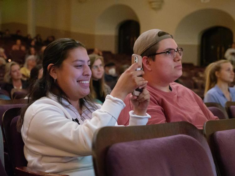 Audience members listen to a keynote speaker at the 2022 Conference on World Affairs